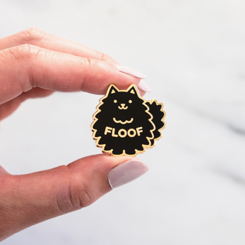 Floof Cat Pin featuring a fluffy black cat design.