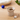 Pet food bowl with pet toys on a wooden surface