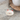 White stoneware cat dish with red ears and nose, designed to reduce whisker stress during feeding
