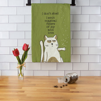 Funny cat kitchen towel with the words "I don't shed. I emit magical fibers of joy and love"