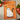 An orange kitchen towel with a cartoon ghost cat and the text 'meow.