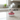 Cat-shaped kitchen timer on a marble countertop with a blurred kitchen background