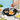 A perfectly cooked egg inside a white cat-shaped silicone egg ring, showing the fun and functional design.