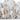 White crib with a pattern of cartoon cats wearing party hats on a white background