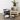 Pet accessories including bowls, a mat, and a small table with a plant on a wooden floor.