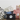 Collection of pet-related products including bags and containers with animal prints on a light background.
