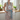 Floral apron with a blue belt on a mannequin against a white background