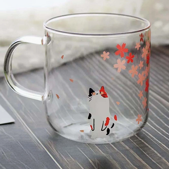 "Thinking Calico Kitty Mug": A glass mug decorated with a pensive calico cat contemplating amidst blossoming cherry trees.