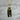 Cat-shaped pendant on a gold chain against a white background
