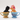 Two ceramic cat figurines in teacups with floral designs on a white background