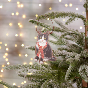 Close-up of Tuxedo Cat Christmas Ornament with festive scarf and personalized wood back.