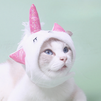 White fluffy Unicorn Cat Hat with a sparkly pink horn and ears.