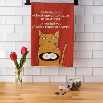 Red cotton kitchen towel with a sassy orange tabby cat and a humorous message about who's in charge.
