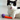 A black and white cat lying on a floor with a purple and orange cat toy in its paws.
