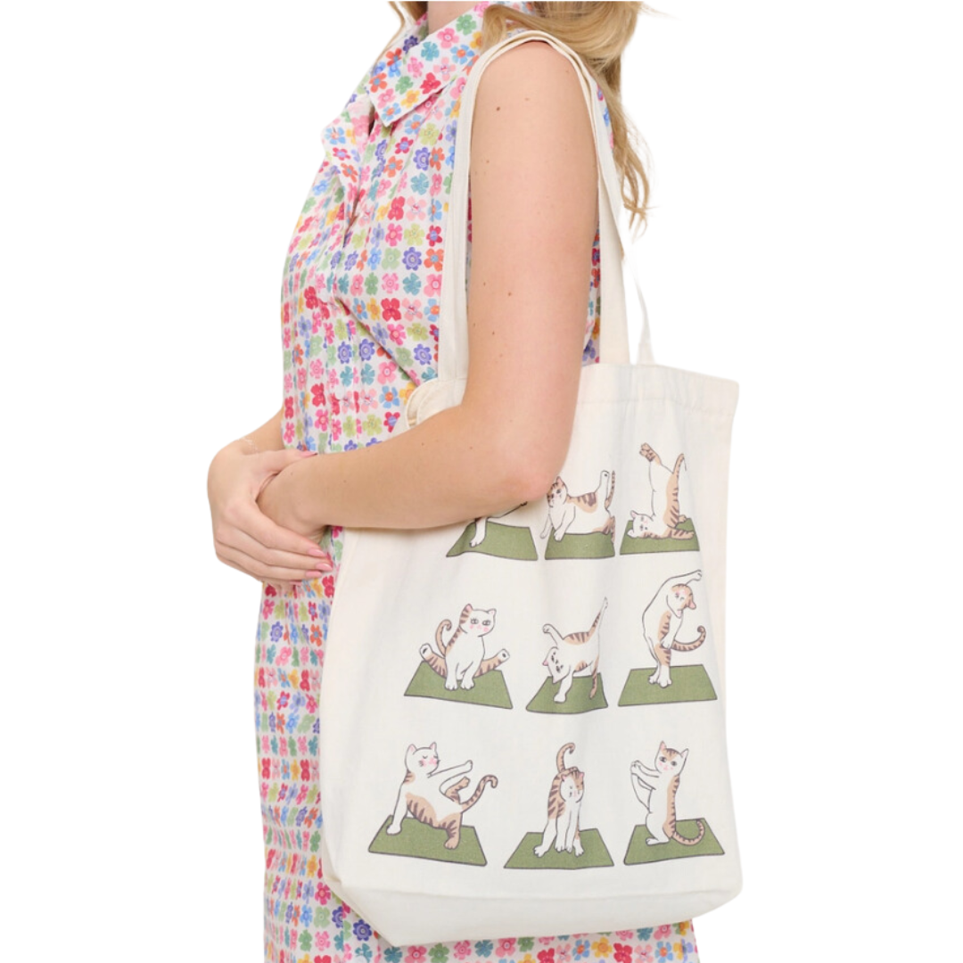 Yoga Cat Tote Bag - W 17", H 16", Strap Length 22". Crafted from a purr-ty blend of 50% Polyester and 50% Cotton for comfort and durability.