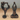 Two bronze cat figurines in yoga poses on a white background