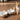 Two white ceramic pet bowls with wooden stands on a white background