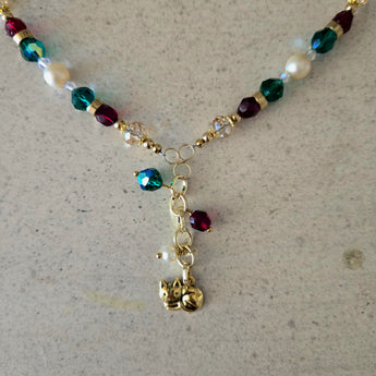 Handmade gold cat lover necklace with pearls, Swarovski crystals, and pewter cat charm.