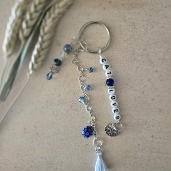 Lapis cat lover keychain with light blue tassel and Millefiori bead.