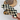 Close-up of mini cat pocket comb in checkered pattern, plastic design, 4 inches.