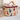 Cheeky Cats Travel Toiletries Bag featuring colorful cat silhouettes on beige fabric with a burgundy vegan leather handle.