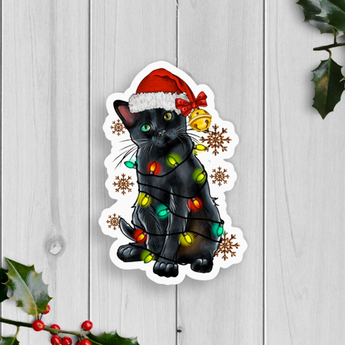 Christmas Cat Sticker with black cat tangled in Christmas lights and Santa hat.