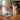 Plush toy with a Santa hat and candy cane pattern on a white background