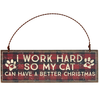 Rustic wooden ornament with the humorous phrase "I Work Hard So My Cat Can Have A Better Christmas," featuring distressed edges and a twisted metal wire for easy hanging.