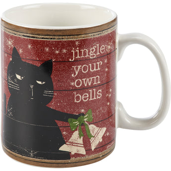 Jingle Your Own Bells Mug featuring a grumpy cat holding Christmas bells and humorous text.