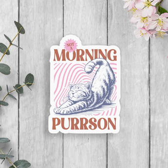 Morning Purrson Sticker featuring a gray tabby cat stretching with matte finish.