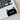 Black cat sticker on a laptop keyboard