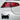Car tail light with a black cat face decal on a white car