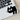 Black cat sticker on a laptop keyboard