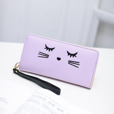 One of our favorite gifts for a cat lover, this cute cat wallet features an embroidered black cat face.