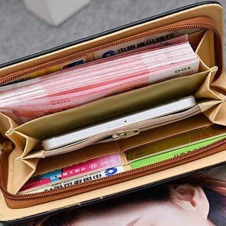 This wristlet wallet is large enough to fit all your cards, your phone, and money.