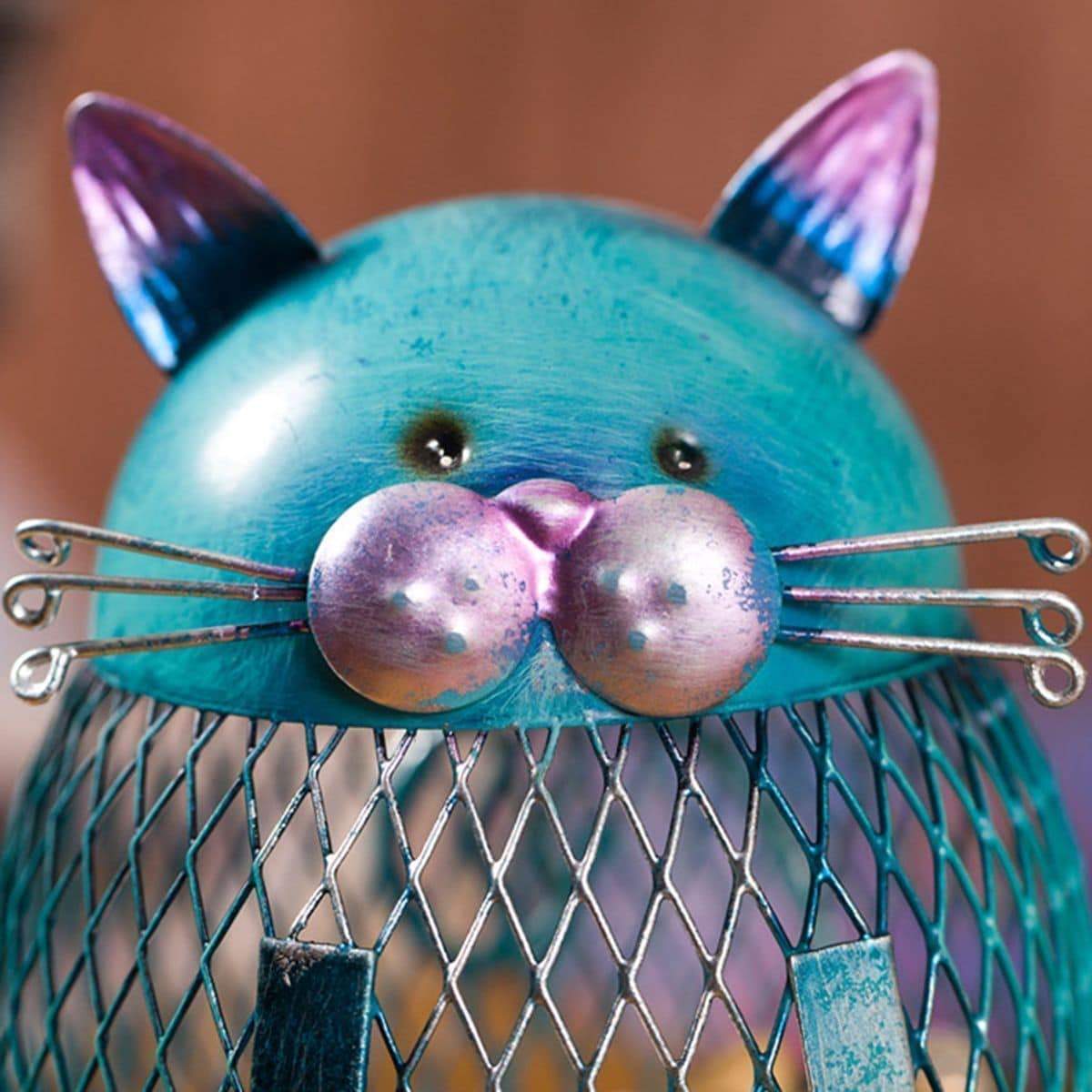 This cat coin bank features beautful hand crafted details, such as a cat's ears, whiskers, nose and eyes.