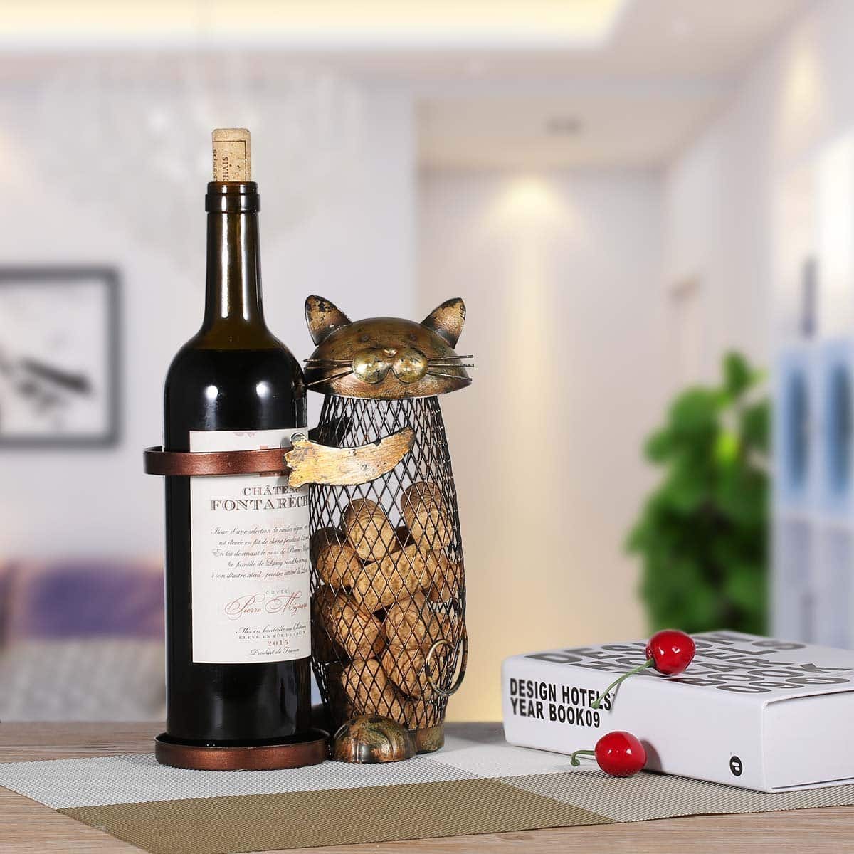 A beautiful cat decoration for your home, this cat wine bottle holder and cork cage are made from dark gold plated iron.