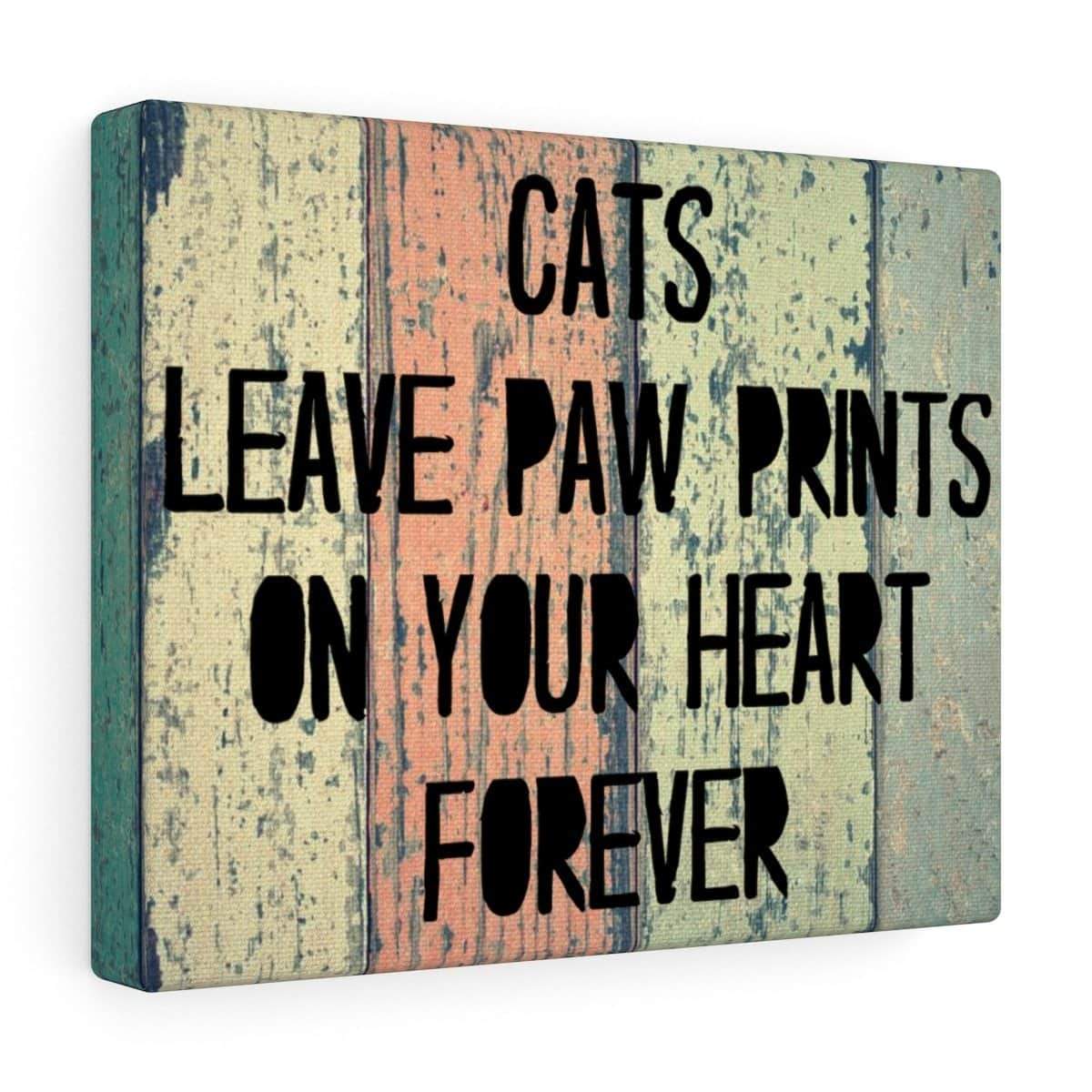 Cat wall art featuring the text "Cats Leave Paw Prints On Your Heart Forever" printed on a 14" by 11" wall canvas