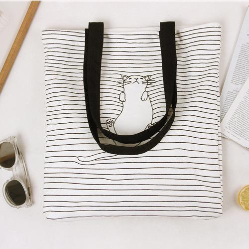 Cat Tote Bag Decorated with a White Cat on a Striped Background